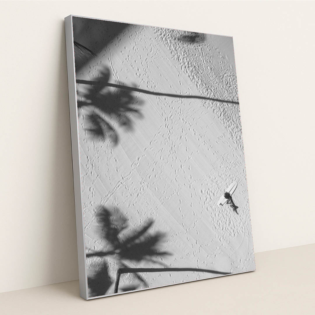 Lying by a surfboard on the beach under palm shadows by Jess Loiterton - Silver Frame Stretchiez
