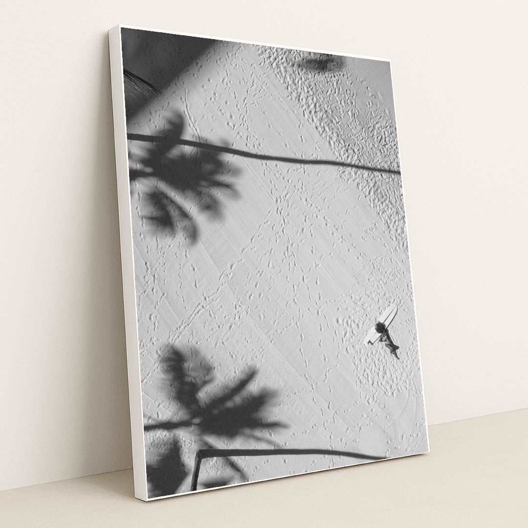 Lying by a surfboard on the beach under palm shadows by Jess Loiterton - White Frame Stretchiez
