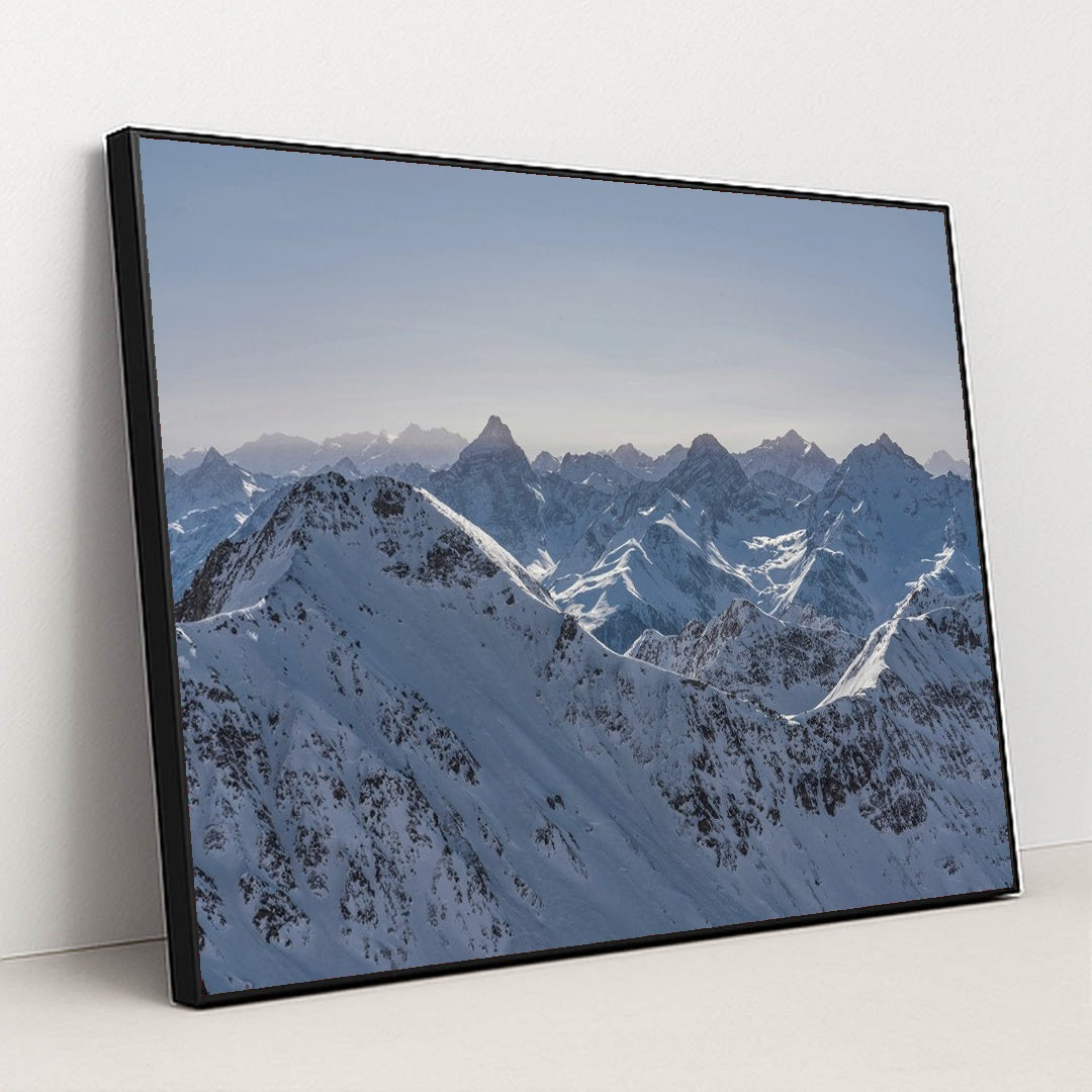 Snow-Covered Mountain Panorama by Susanne Jutzeler, suju-foto - Black Frame Stretchiez