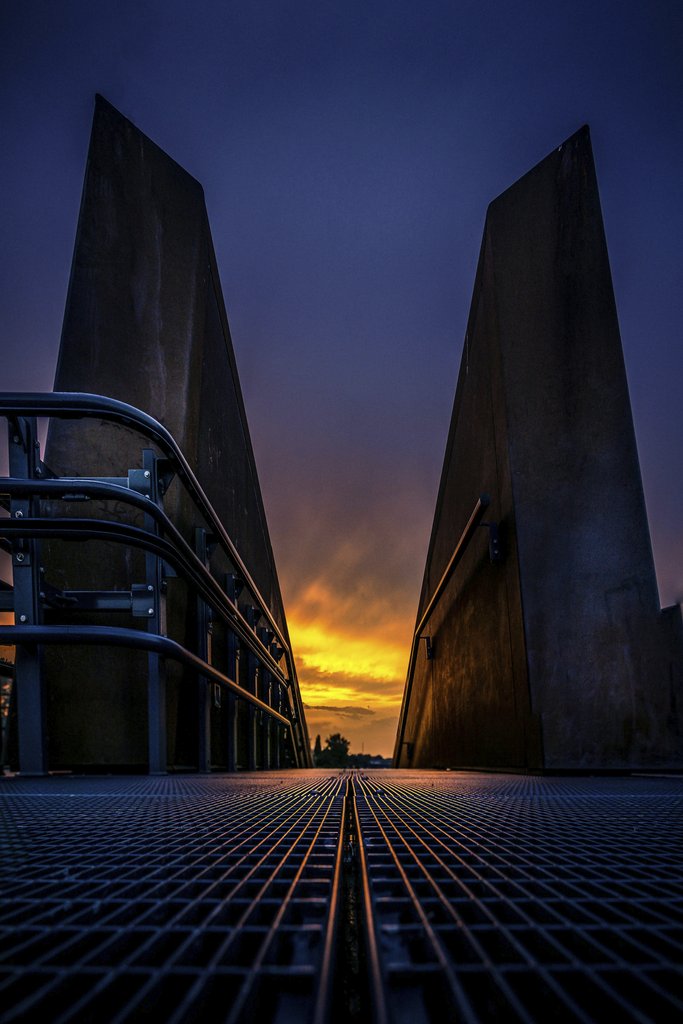 Silhouette of Warsaw's Modern Architecture at Sunset by Adam Borkowski