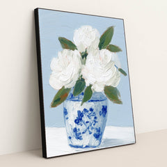 This artwork features white textured flowers in a blue and white vase painted with thick brushstrokes, in a black frame.