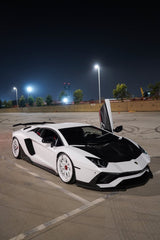 Stunning White Lamborghini Aventador in urban setting, perfect car wall art for enthusiasts and collectors.