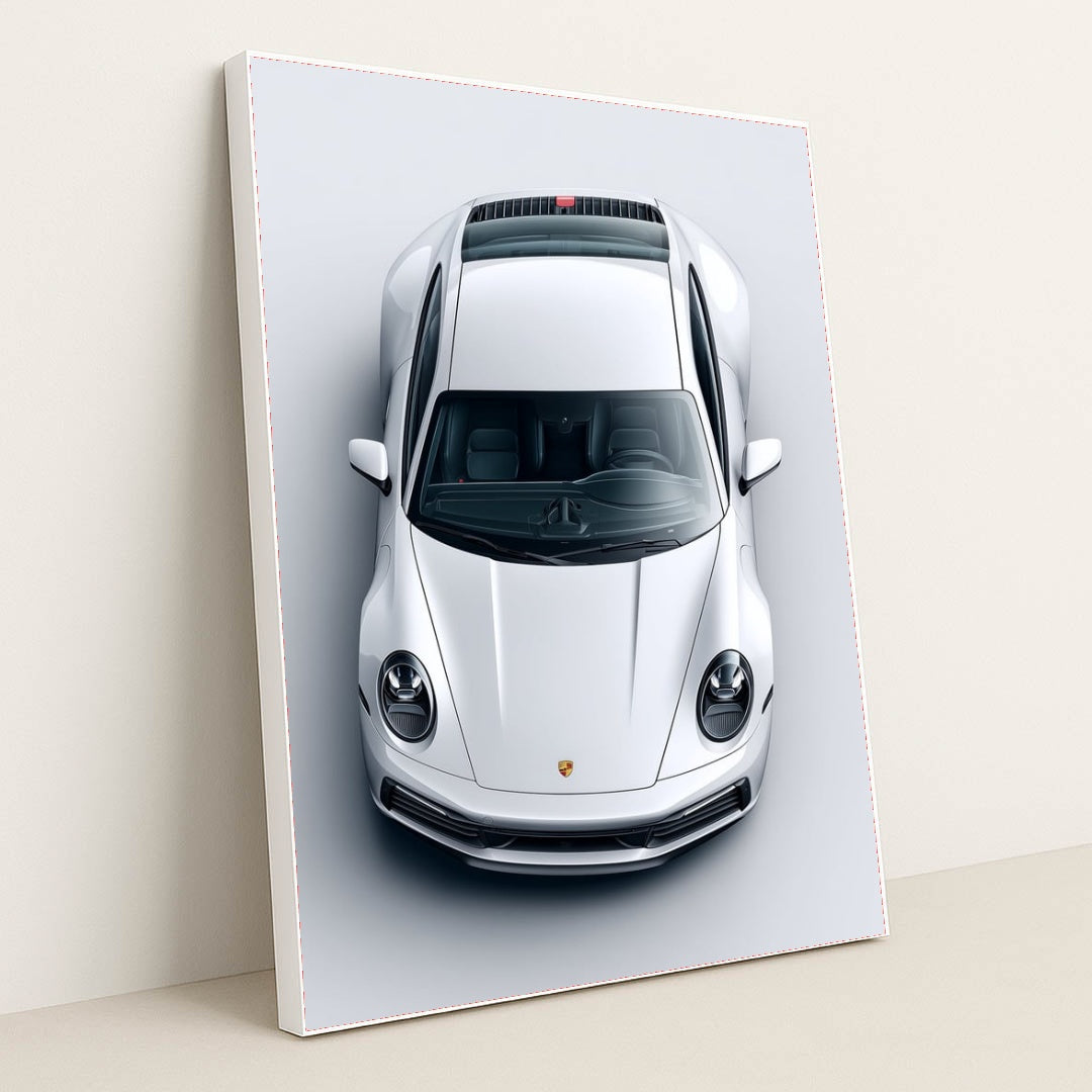 This photo shows a top-down view of a white Porsche 911 against a light gray background, in a white frame.