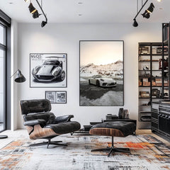 Contemporary living room featuring Porsche 911 GT3 in Alpine Stillness wall art, showcasing snowy mountains and a sleek white car.