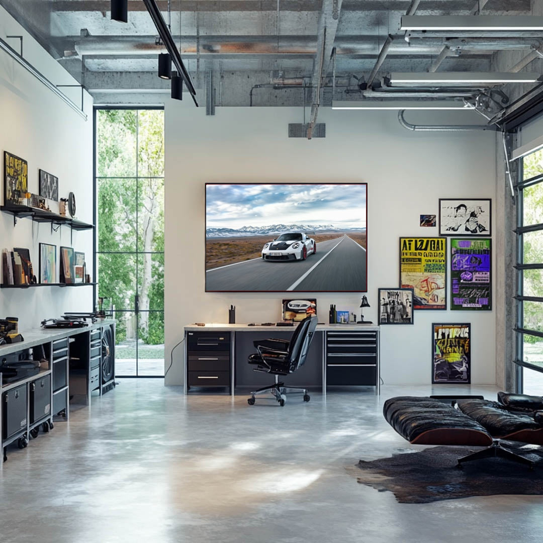 Porsche 911 GT3 RS on Desert Highway wall art displayed in a modern office with natural light and stylish decor.