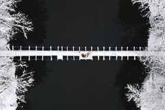 Winter Footbridge Over Dark River by Maksim Goncharenok